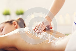 Beautiful woman having exfoliation treatment in spa