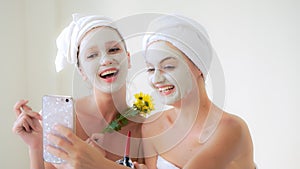 Beautiful woman having a facial treatment at spa.