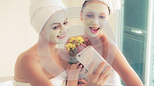 Beautiful woman having a facial treatment at spa.