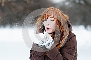 Beautiful woman having fun in winter