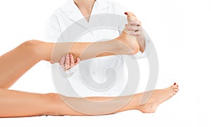 Beautiful woman having massage leg at spa salon