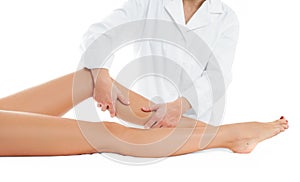 Beautiful woman having massage leg at spa salon