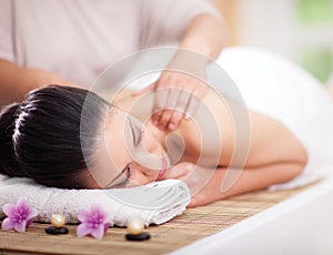 Beautiful woman having a wellness back massage