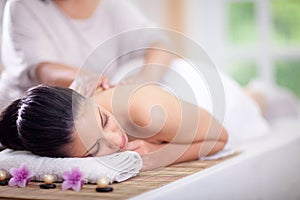 Beautiful woman having a wellness back massage