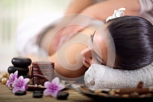 Beautiful woman having a wellness back massage