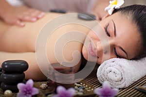 Beautiful woman having a wellness back massage