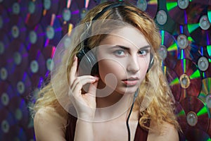 Beautiful woman in headphones have fun and listen music
