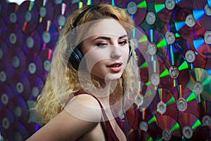 Beautiful woman in headphones have fun and listen music