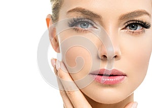 Beautiful woman with healthy skin natural makeup blonde hair beauty face with beauty lashes and pink lips