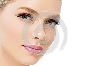 Beautiful woman with healthy skin natural makeup blonde hair beauty face with beauty lashes and pink lips