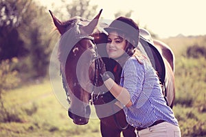 Beautiful woman with her horse