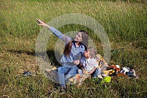 Beautiful woman with her son on a picnic