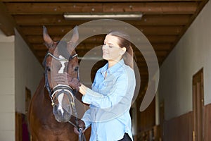 Beautiful woman with her sport horse