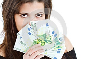 Beautiful woman hiding behind banknotes