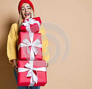 Beautiful woman hold red Christmas birthday or valentines presents gift boxes for new year celebration