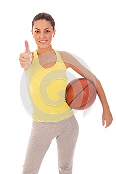 Beautiful woman holding a basketball ball