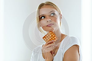 Beautiful Woman Holding Birth Control Pills, Oral Contraceptive