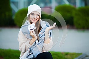 Beautiful woman holding cards with funny smile