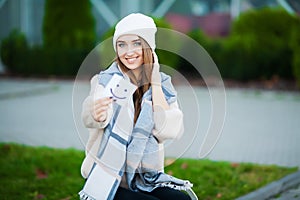 Beautiful woman holding cards with funny smile