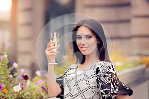 Beautiful Woman Holding Champagne Glass and Celebrating