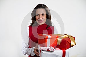 Beautiful woman holding Christmas gifts photo