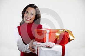 Beautiful woman holding Christmas gifts photo