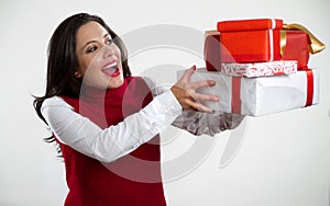 Beautiful woman holding Christmas gifts photo