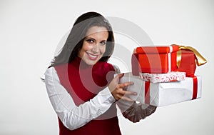 Beautiful woman holding Christmas gifts photo