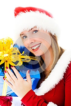 Beautiful woman holding a Christmas present