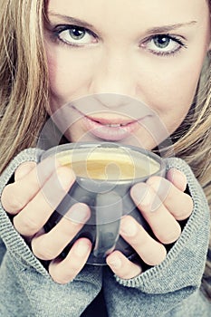 Beautiful woman holding cup of coffee