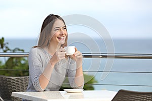 Beautiful woman holding a cup of coffee in a restaurant