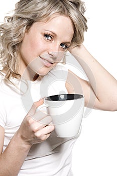 Beautiful woman holding a cup of tea or coffee