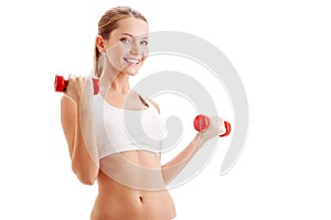 Beautiful woman holding dumbbells