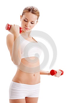 Beautiful woman holding dumbbells