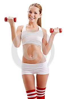 Beautiful woman holding dumbbells