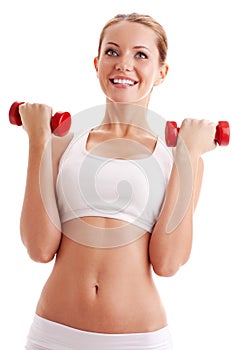 Beautiful woman holding dumbbells