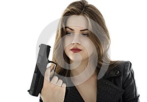 Beautiful woman holding a gun on white background