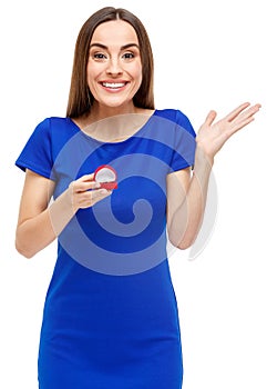 Beautiful woman holding heart shaped box with ring