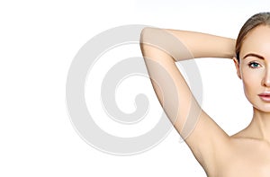 Beautiful woman holding her arms with clean underarms. Epilation photo