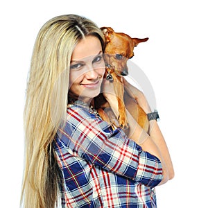 Beautiful woman holding her little puppy dog over white background