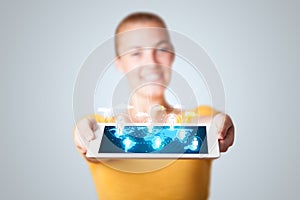 Beautiful woman holding modern tablet with social icons