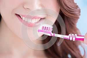 Beautiful woman holding tooth brush