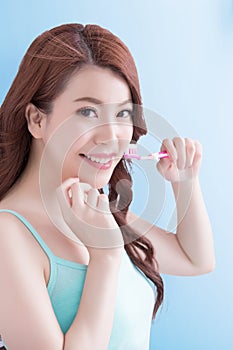 Beautiful woman holding tooth brush