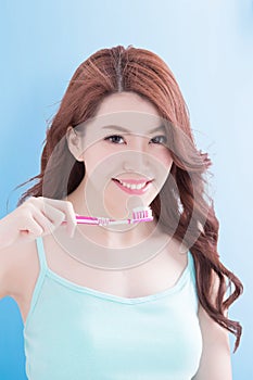 Beautiful woman holding tooth brush