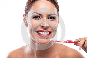 Beautiful woman holding a toothbrush