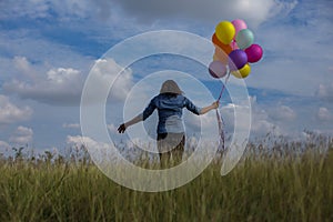 Beautiful woman Holding a transparent ball in the grass field photo