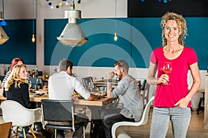 Beautiful Woman Holding Wineglass At Cafe