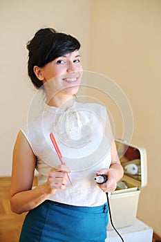 Beautiful woman holds red comb