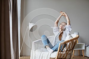 Beautiful woman at home relaxing in cozy chair