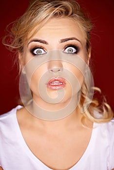 Beautiful woman with a horrified expression photo